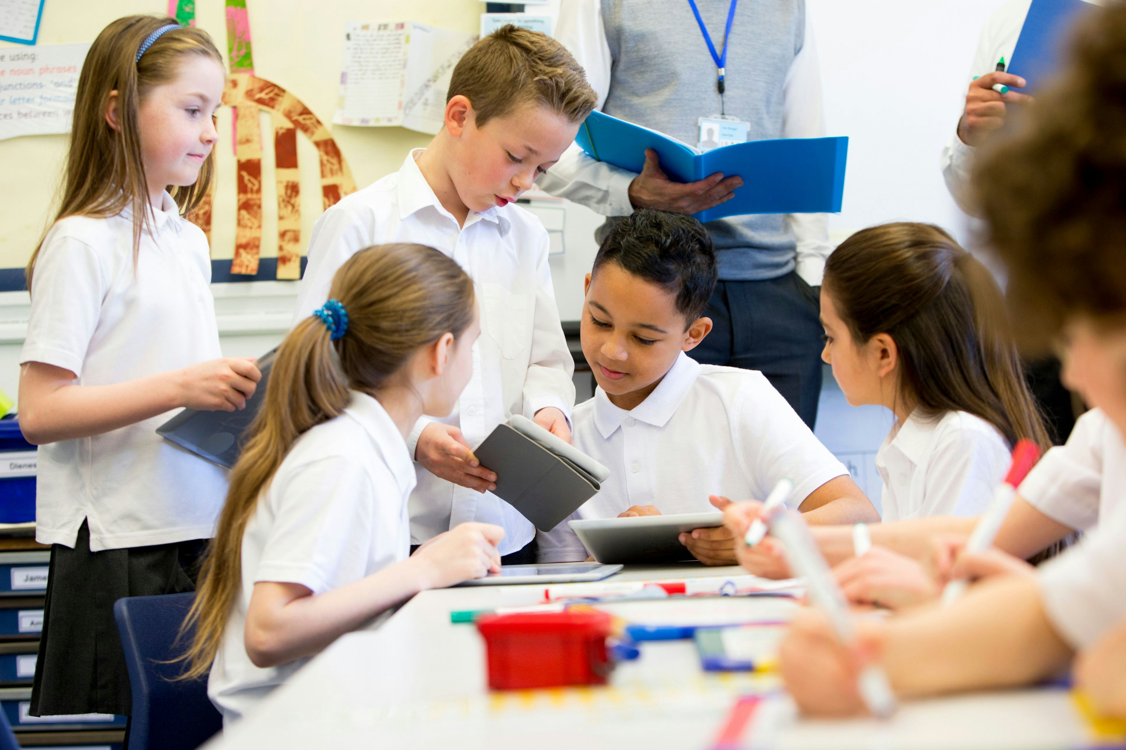 Children in classroom around a table