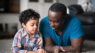 Father reading to son