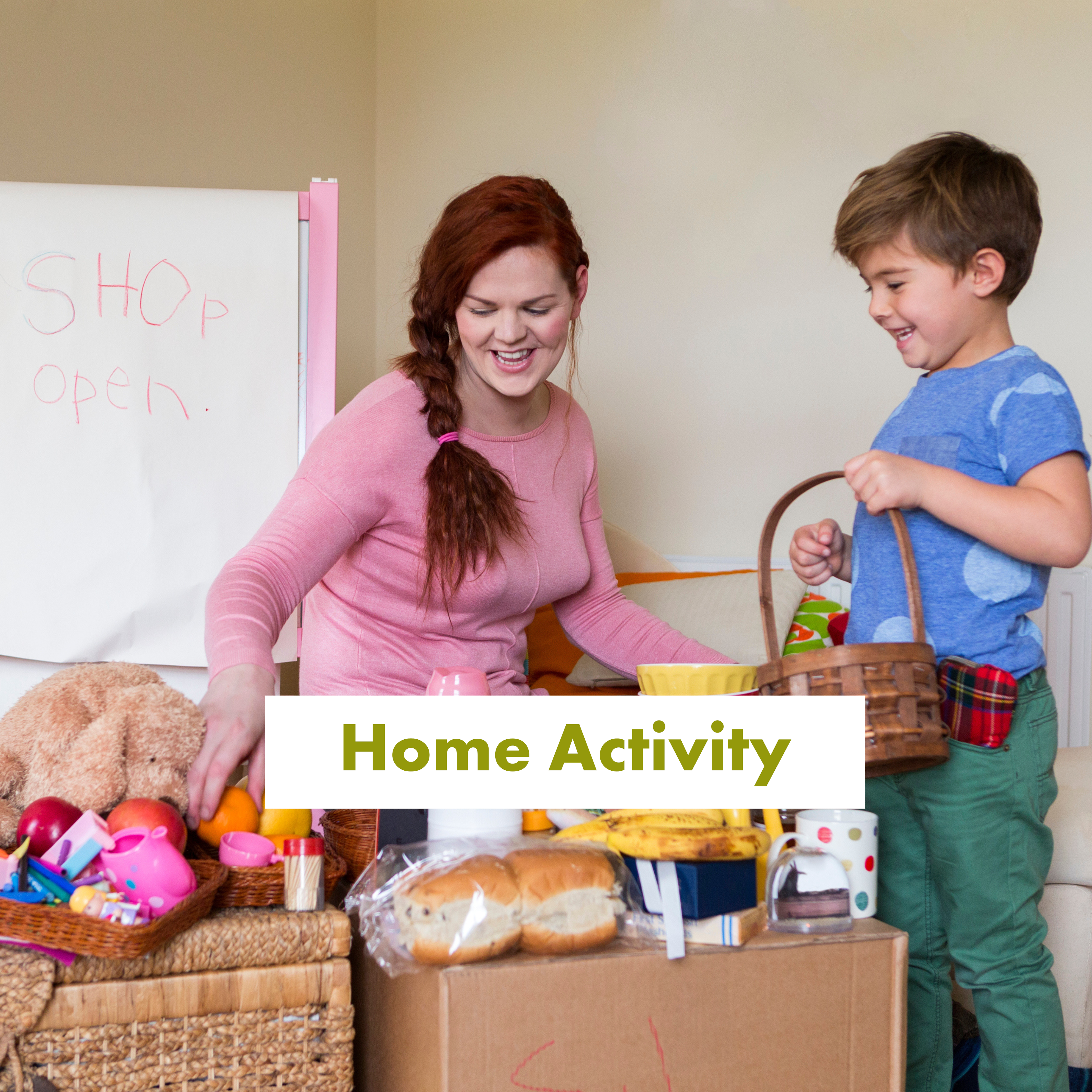 A mother and son play pretend shops at home with food items.
